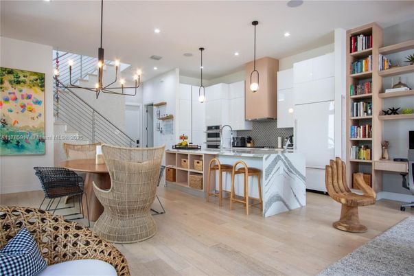 Chandelier, Dining room, Interior, Kitchen, Pendant Lights, Recessed Lighting, Stainless Steel Appliances, Wood Texture Flooring