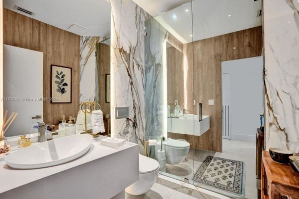 Bathroom, Dual Sink Vanities, Glass Shower, Interior, Marble Walls, Recessed Lighting, Wooden Walls