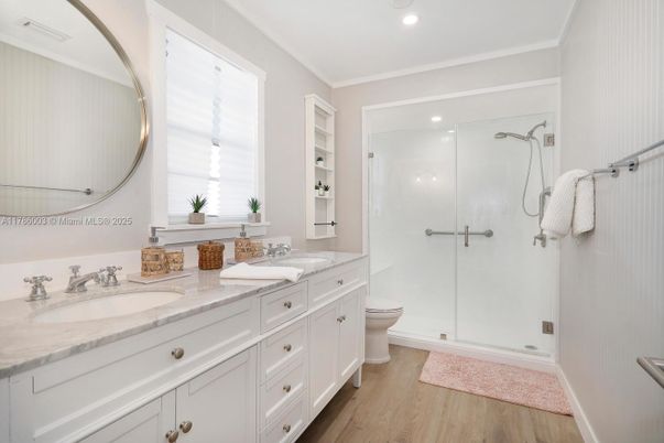 Bathroom, Dual Sink Vanities, Glass Shower, Interior, Recessed Lighting, Wood Texture Flooring