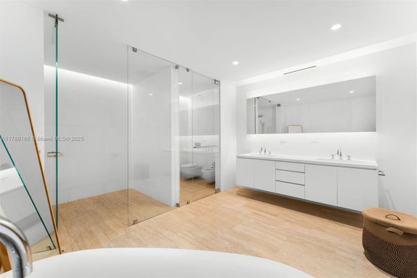 Bathroom, Dual Sink Vanities, Glass Shower, Interior, Recessed Lighting, Wood Texture Flooring