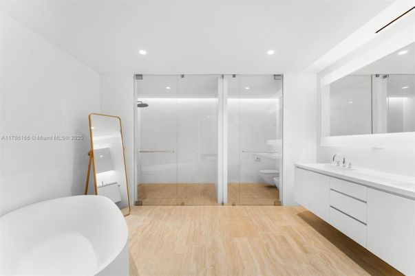 Bathroom, Dual Sink Vanities, Free Standing Baths, Glass Shower, Interior, Recessed Lighting, Wood Texture Flooring