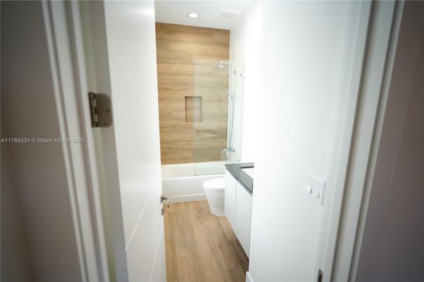 Bathroom, Glass Shower, Interior, Recessed Lighting, Wood Texture Flooring