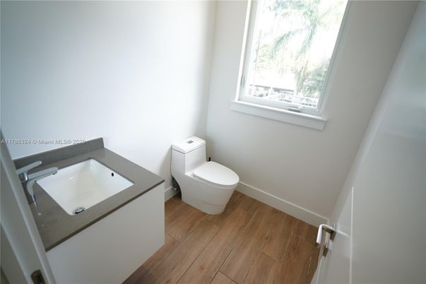 Bathroom, Dual Sink Vanities, Interior, Recessed Lighting, Wood Texture Flooring
