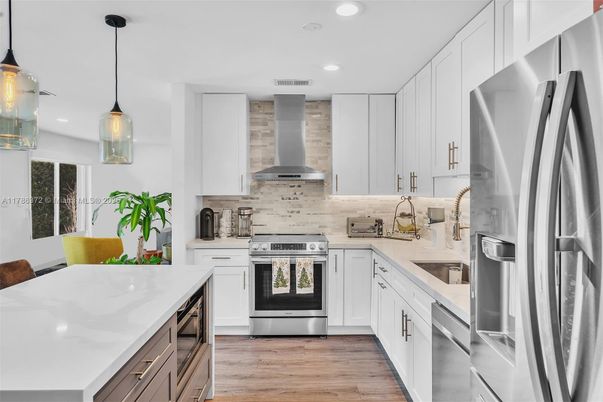 Interior, Kitchen, Pendant Lights, Recessed Lighting, Stainless Steel Appliances, Wood Texture Flooring