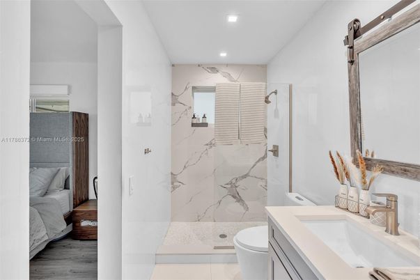 Bathroom, Glass Shower, Interior, Marble Walls, Recessed Lighting, Wood Texture Flooring