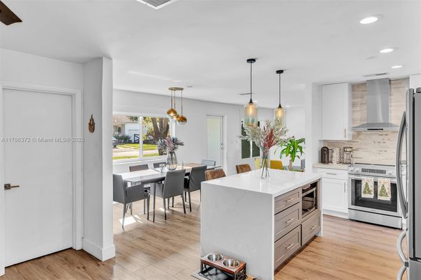 Dining room, Interior, Kitchen, Pendant Lights, Recessed Lighting, Stainless Steel Appliances, Wood Texture Flooring