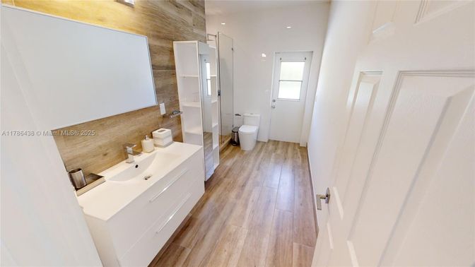 Bathroom, Dual Sink Vanities, Interior, Recessed Lighting, Wood Texture Flooring