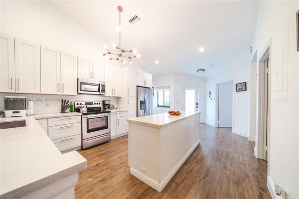 Interior, Kitchen, Pendant Lights, Recessed Lighting, Stainless Steel Appliances, Wood Texture Flooring