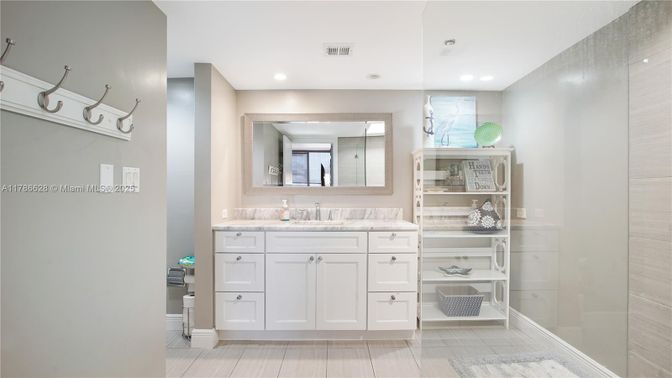 Bathroom, Dual Sink Vanities, Glass Shower, Interior, Recessed Lighting, Wood Texture Flooring