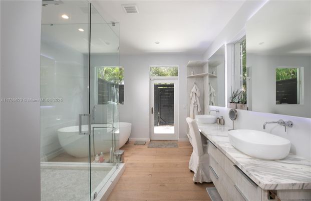 Bathroom, Dual Sink Vanities, Free Standing Baths, Glass Shower, Interior, Recessed Lighting, Wood Texture Flooring