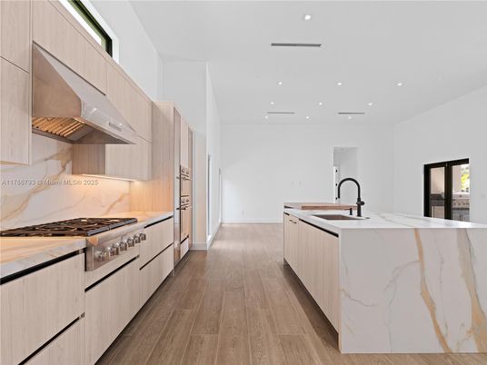 Interior, Kitchen, Marble Walls, Recessed Lighting, Stainless Steel Appliances, Wood Texture Flooring