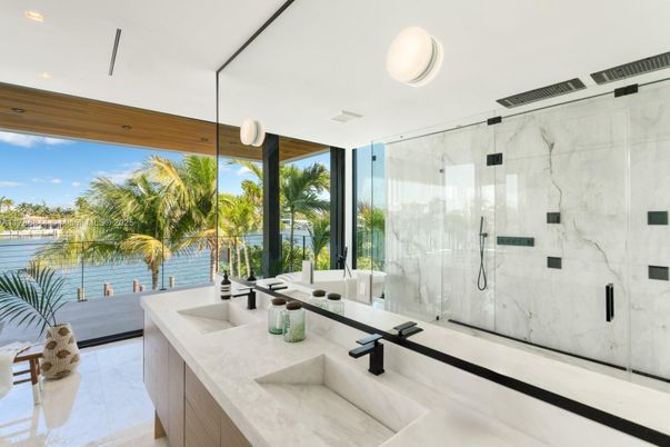 Bathroom, Dual Sink Vanities, Glass Shower, Interior, Marble, Marble Walls, Recessed Lighting, Water