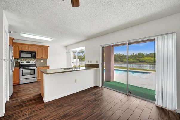 Interior, Kitchen, Stainless Steel Appliances, Water, Wood Texture Flooring