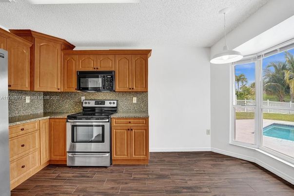 Interior, Kitchen, Pendant Lights, Stainless Steel Appliances, Wood Texture Flooring