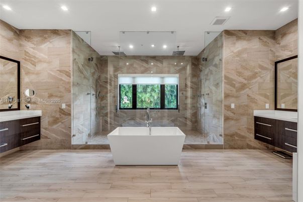 Bathroom, Free Standing Baths, Glass Shower, Interior, Marble Walls, Recessed Lighting, Wood Texture Flooring