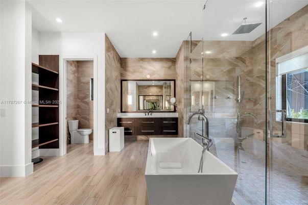 Bathroom, Free Standing Baths, Glass Shower, Interior, Recessed Lighting, Wood Texture Flooring