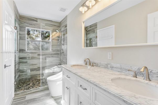 Bathroom, Dual Sink Vanities, Glass Shower, Interior, Wood Texture Flooring
