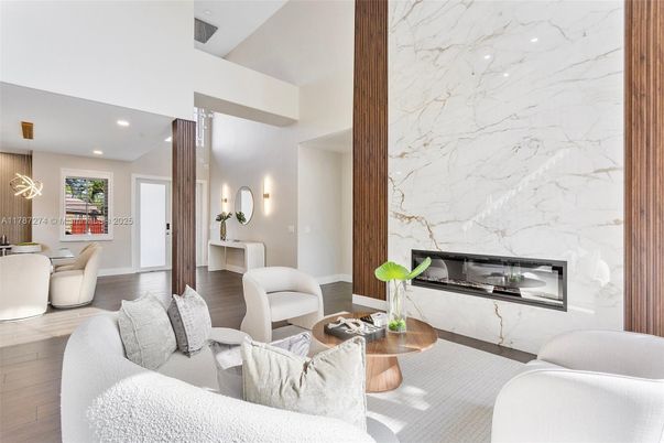Fireplace, Interior, Living room, Marble Walls, Recessed Lighting, Wood Texture Flooring