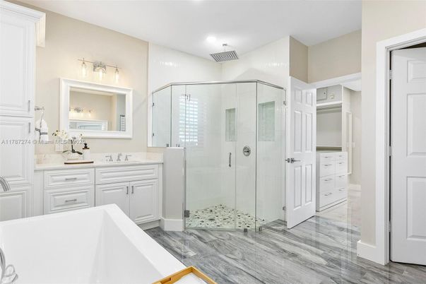 Bathroom, Dual Sink Vanities, Glass Shower, Interior, Recessed Lighting, Wood Texture Flooring
