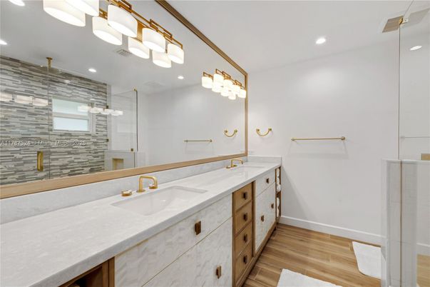 Bathroom, Dual Sink Vanities, Glass Shower, Interior, Recessed Lighting, Wood Texture Flooring