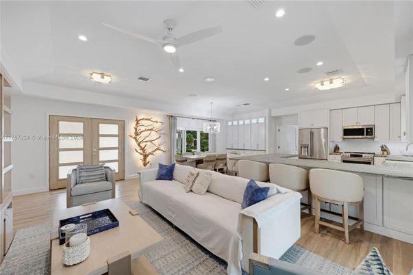 Chandelier, Dining room, Interior, Kitchen, Living room, Pendant Lights, Recessed Lighting, Stainless Steel Appliances, Wood Texture Flooring