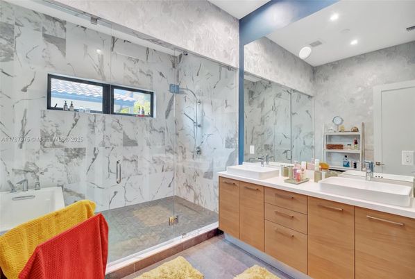 Bathroom, Dual Sink Vanities, Glass Shower, Interior, Marble Walls, Recessed Lighting
