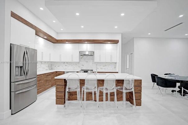 Interior, Kitchen, Marble Walls, Recessed Lighting, Stainless Steel Appliances