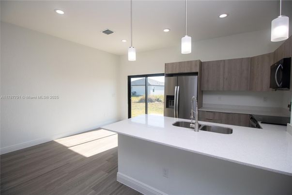 Interior, Kitchen, Pendant Lights, Recessed Lighting, Stainless Steel Appliances, Wood Texture Flooring