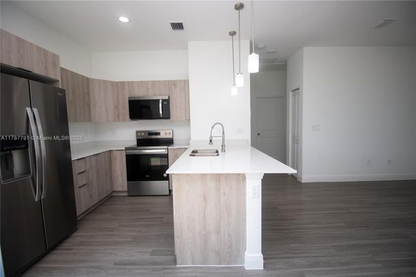 Interior, Kitchen, Pendant Lights, Recessed Lighting, Stainless Steel Appliances, Wood Texture Flooring