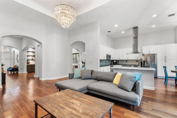 Chandelier, Interior, Kitchen, Living room, Recessed Lighting, Stainless Steel Appliances, Wood Texture Flooring
