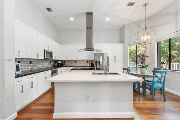 Dining room, Interior, Kitchen, Pendant Lights, Recessed Lighting, Stainless Steel Appliances, Wood Texture Flooring