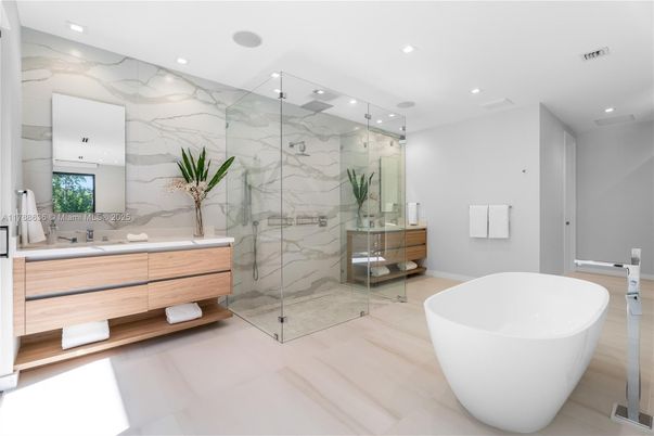 Bathroom, Dual Sink Vanities, Free Standing Baths, Glass Shower, Interior, Marble Walls, Recessed Lighting