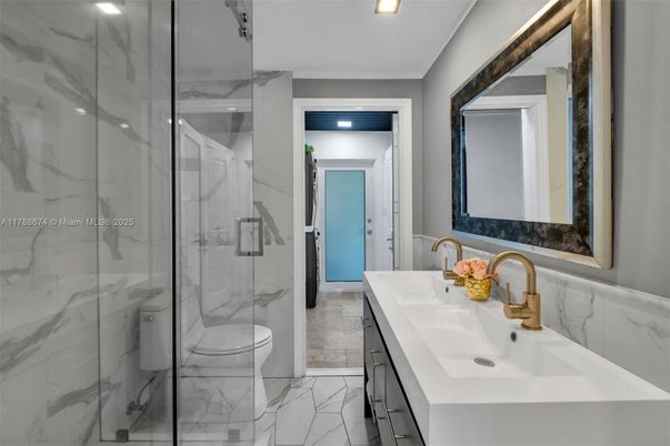Bathroom, Dual Sink Vanities, Glass Shower, Interior, Marble, Marble Walls, Recessed Lighting