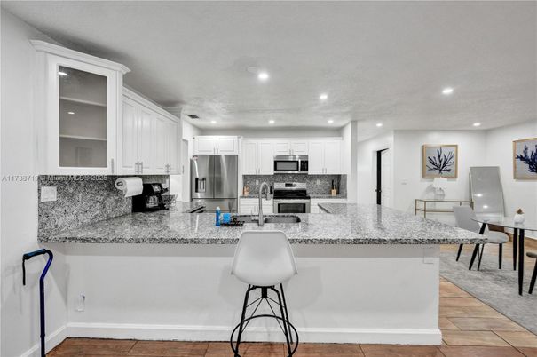 Dining room, Interior, Kitchen, Recessed Lighting, Stainless Steel Appliances, Wood Texture Flooring