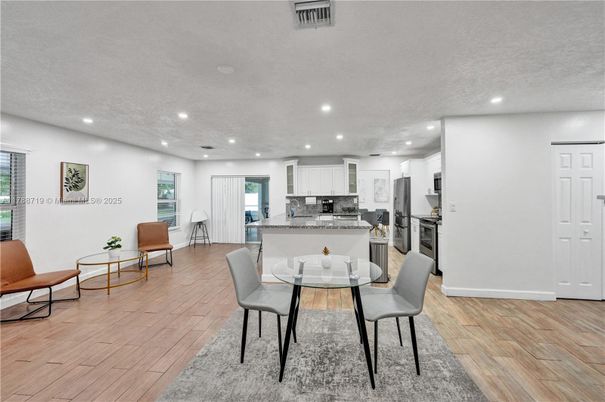 Dining room, Interior, Kitchen, Recessed Lighting, Stainless Steel Appliances, Wood Texture Flooring