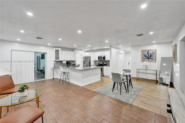 Dining room, Interior, Kitchen, Recessed Lighting, Stainless Steel Appliances, Wood Texture Flooring