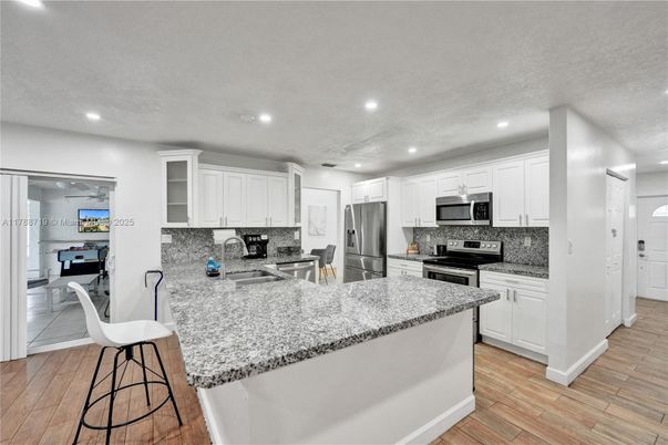 Interior, Kitchen, Recessed Lighting, Stainless Steel Appliances, Wood Texture Flooring