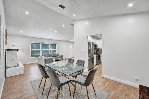 Dining room, Interior, Kitchen, Living room, Recessed Lighting, Stainless Steel Appliances, Wood Texture Flooring