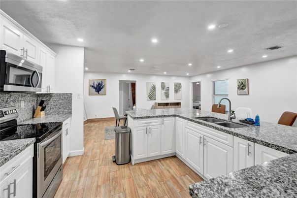 Interior, Kitchen, Recessed Lighting, Stainless Steel Appliances, Wood Texture Flooring