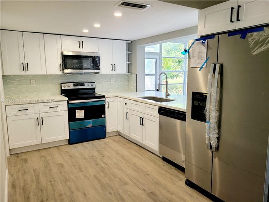 Interior, Kitchen, Recessed Lighting, Stainless Steel Appliances, Wood Texture Flooring