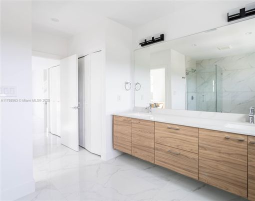 Bathroom, Dual Sink Vanities, Glass Shower, Interior, Marble, Marble Walls, Recessed Lighting