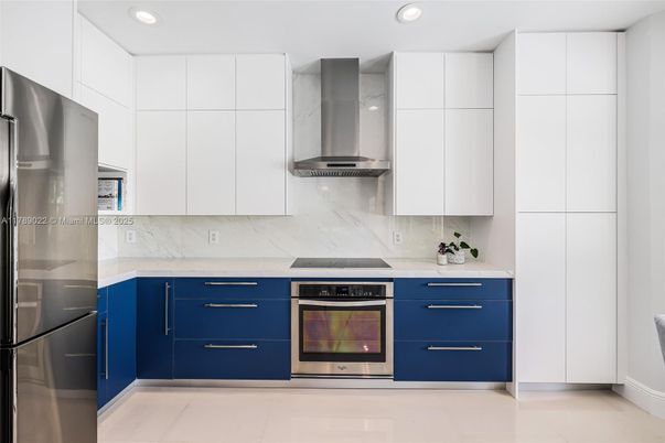 Interior, Kitchen, Marble Walls, Recessed Lighting, Stainless Steel Appliances