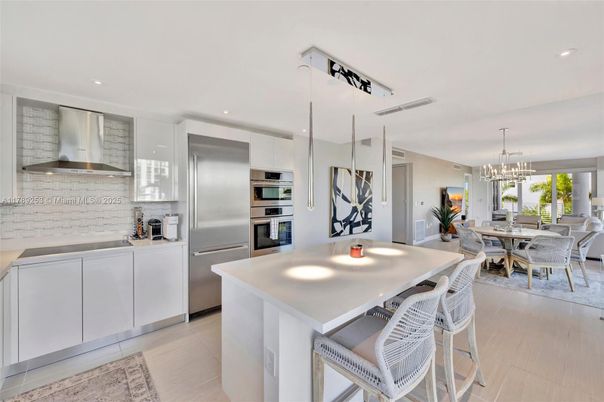 Chandelier, Dining room, Interior, Kitchen, Pendant Lights, Recessed Lighting, Stainless Steel Appliances, Wood Texture Flooring