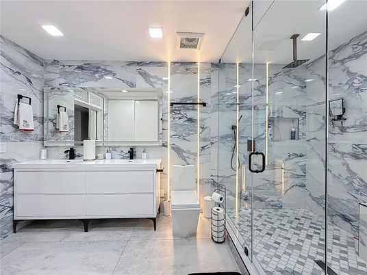 Bathroom, Dual Sink Vanities, Glass Shower, Interior, Marble, Marble Walls, Recessed Lighting