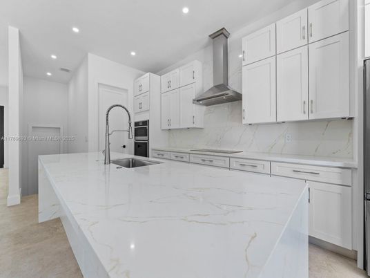 Interior, Kitchen, Marble Walls, Recessed Lighting, Stainless Steel Appliances