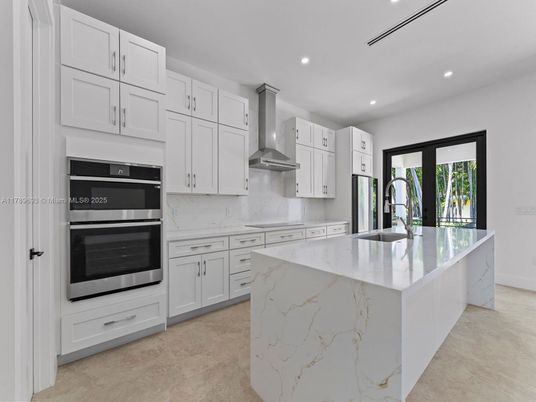 Interior, Kitchen, Marble Walls, Recessed Lighting, Stainless Steel Appliances