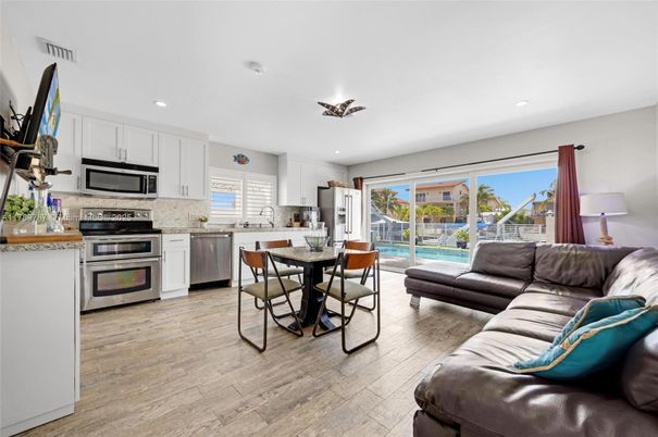 Dining room, Interior, Kitchen, Living room, Recessed Lighting, Stainless Steel Appliances, Wood Texture Flooring