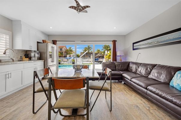 Dining room, Interior, Kitchen, Living room, Recessed Lighting, Stainless Steel Appliances, Wood Texture Flooring