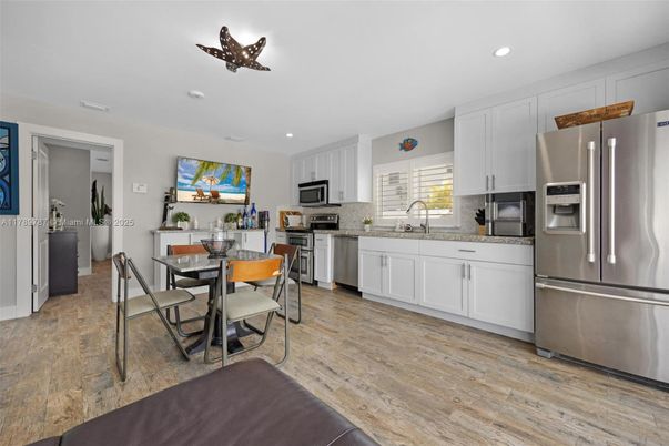 Dining room, Interior, Kitchen, Recessed Lighting, Stainless Steel Appliances, Wood Texture Flooring