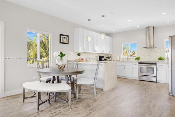 Dining room, Interior, Kitchen, Pendant Lights, Recessed Lighting, Stainless Steel Appliances, Wood Texture Flooring